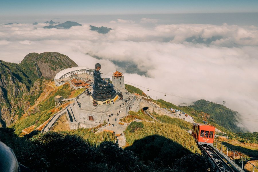 Buddha statue above a sea of clouds on Fansipan, Sapa