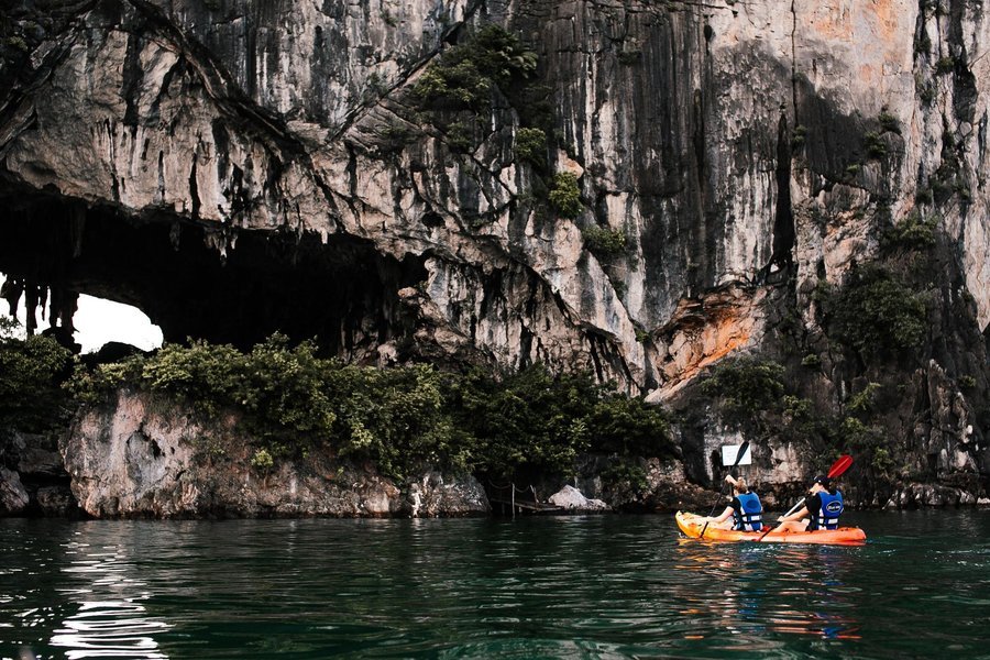 Kayaking beneath limestone cliffs in Ha Long Bay