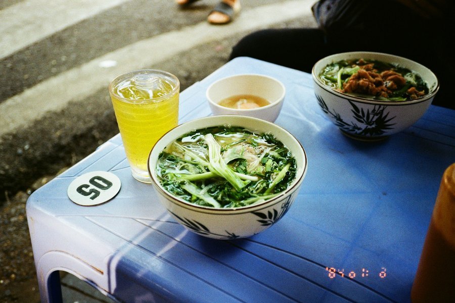 Hanoi pho served at a sidewalk table