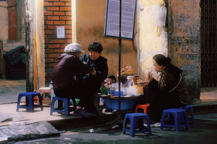 A sidewalk street food stall in Hanoi