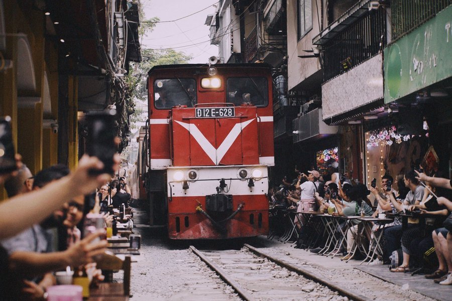 A train passing along Train Street in Hanoi