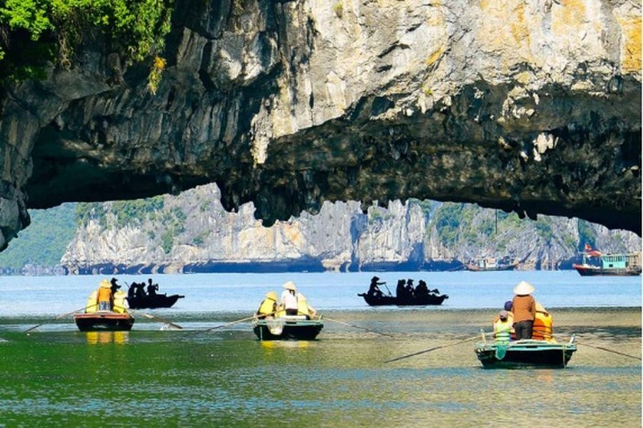 Rowing boats at Dark and Bright Cave, Lan Ha Bay