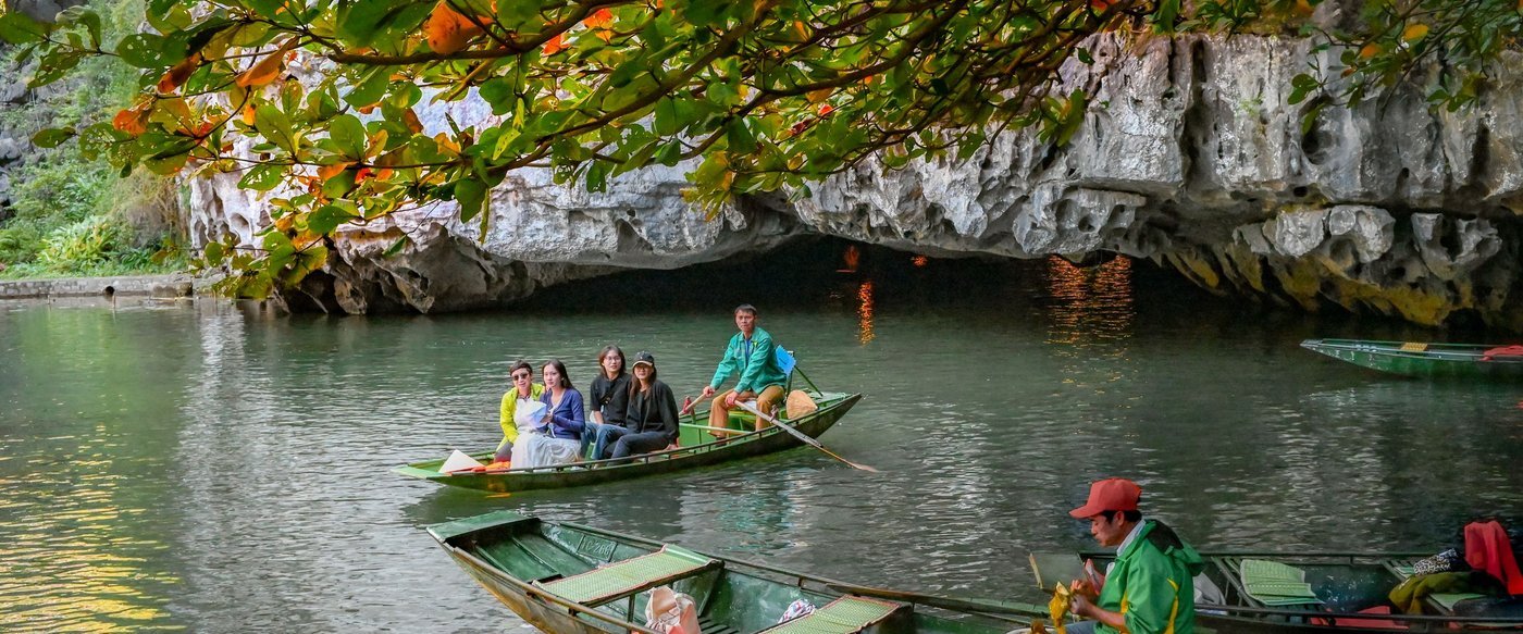 Boat passing through a cave in Trang An, Ninh Binh