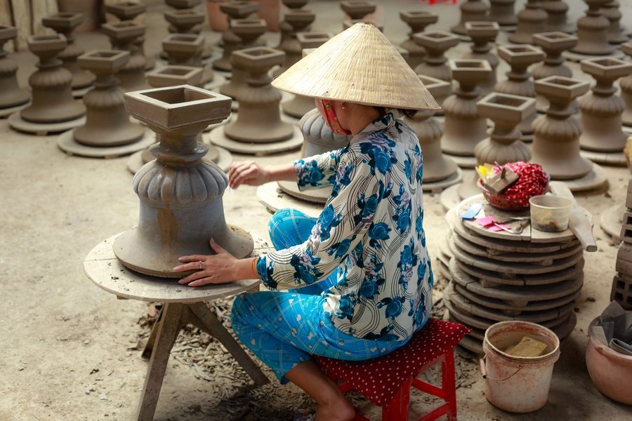 Potter shaping clay in a pottery village