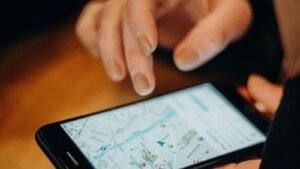 A hand using a map app on a smartphone
